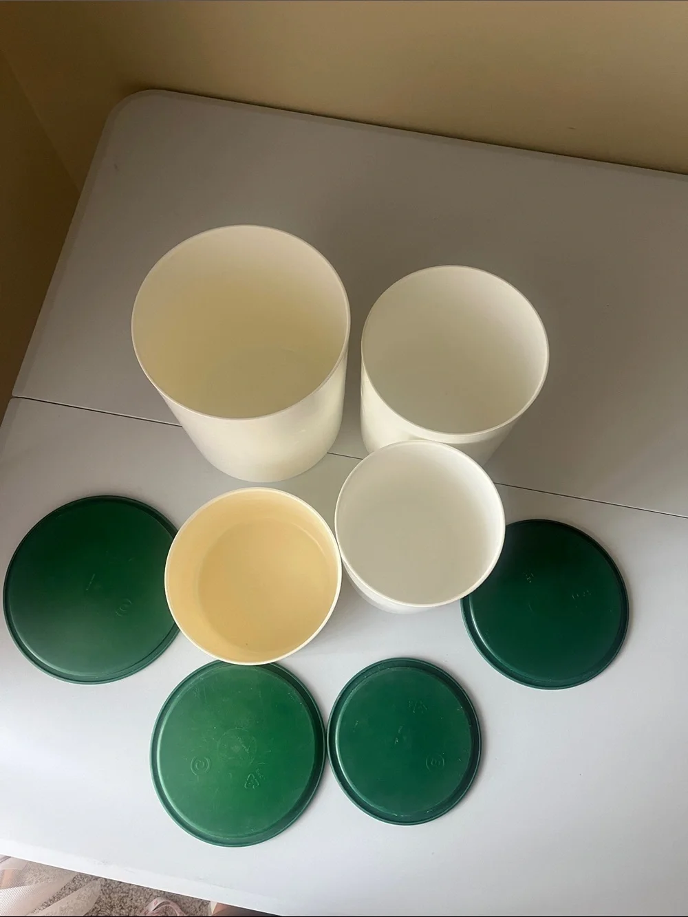 vintage one touch Tupperware Cream Containers with Dark Green Lids set of four